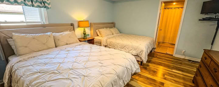 One Queen Bed in a Shared Two Queen Bedroom with Shared Bathroom