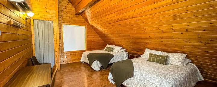 One Queen Loft Bed in a Shared Two Queen Cabin Loft with Shared Bathrooms