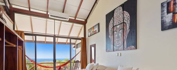 Hanuman Room, by bed
